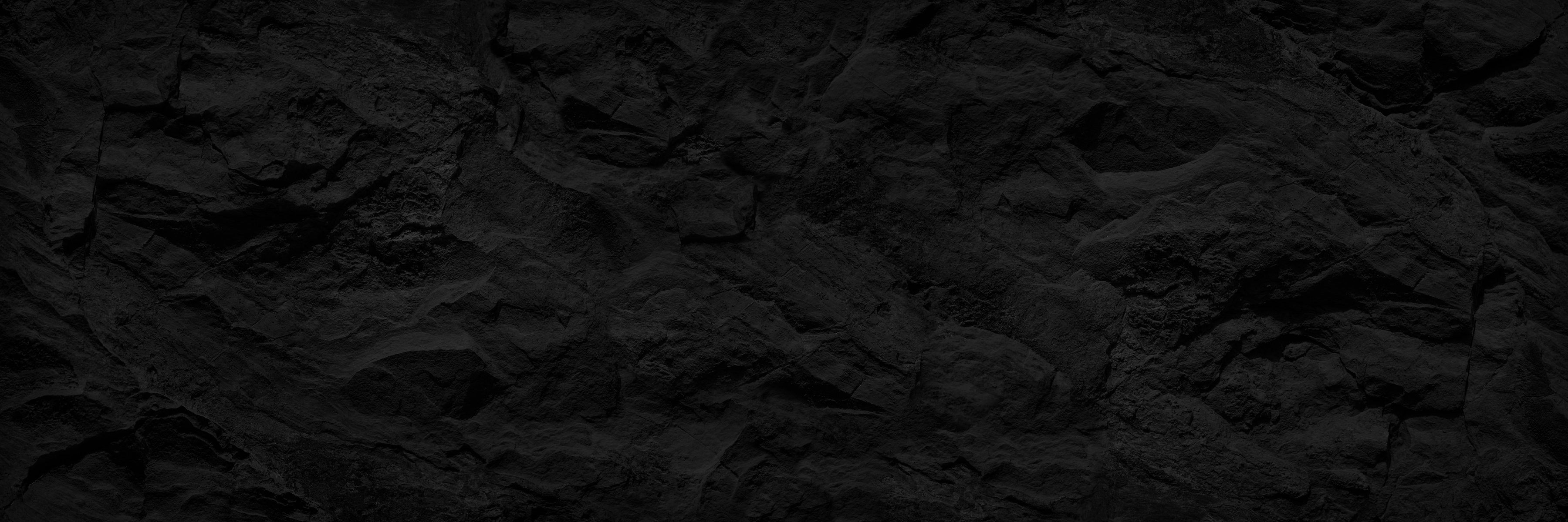 Abstract black background. Dark stone background. Black rock texture.